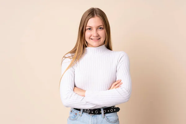Adolescente Ucraniana Chica Aislada Sobre Fondo Beige Mantener Los Brazos —  Fotos de Stock