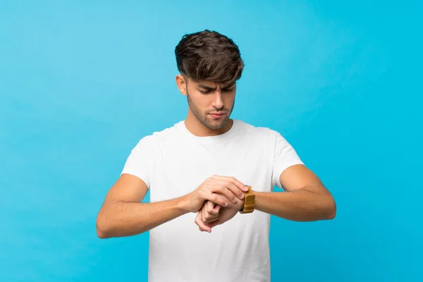 Young Handsome Man Isolated Blue Background Wrist Watch — Stock Photo, Image