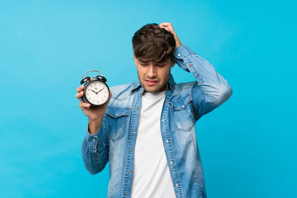 Young Handsome Man Isolated Blue Background Holding Vintage Alarm Clock — Stock Photo, Image