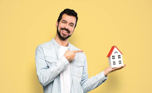 Handsome Man Beard Holding Little House Isolated Yellow Background — 图库照片