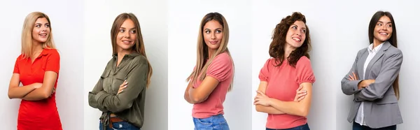 Beyaz Arka Planda Kolları Bağlı Mutlu Bir Grup Genç Kadın — Stok fotoğraf