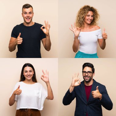İzole edilmiş arka planda, tamam işareti ve işaret parmağı gösteren bir grup insan
