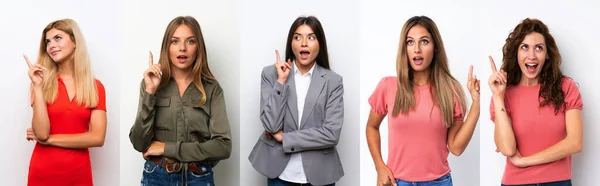 Conjunto Mulheres Jovens Sobre Fundo Branco Pensando Uma Ideia Apontando — Fotografia de Stock