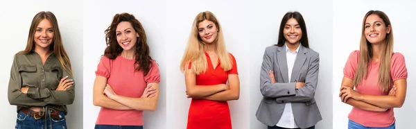 Conjunto Mulheres Jovens Sobre Fundo Branco Mantendo Braços Cruzados Posição — Fotografia de Stock