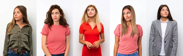 Conjunto Mulheres Jovens Sobre Fundo Branco Fazendo Dúvidas Gesto Olhando — Fotografia de Stock