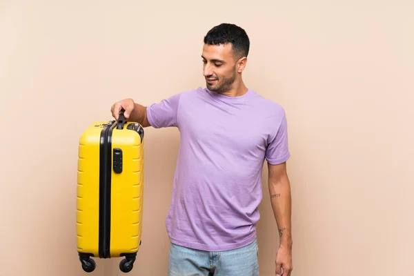 Homem Segurando Uma Mala Sobre Fundo Isolado Com Expressão Feliz — Fotografia de Stock