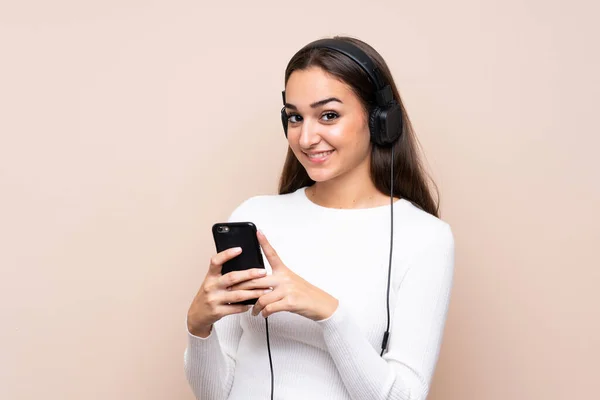 Young Woman Isolated Background Using Mobile Headphones — Stock Photo, Image