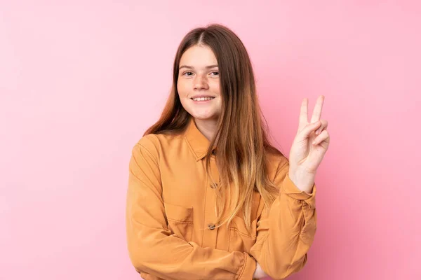 Ukrajinský Teenager Dívka Přes Izolované Růžové Pozadí Úsměvem Ukazující Vítězství — Stock fotografie