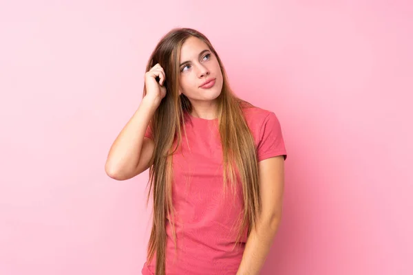 Teenager Blonde Girl Isolated Pink Background Having Doubts Confuse Face — Stock Photo, Image