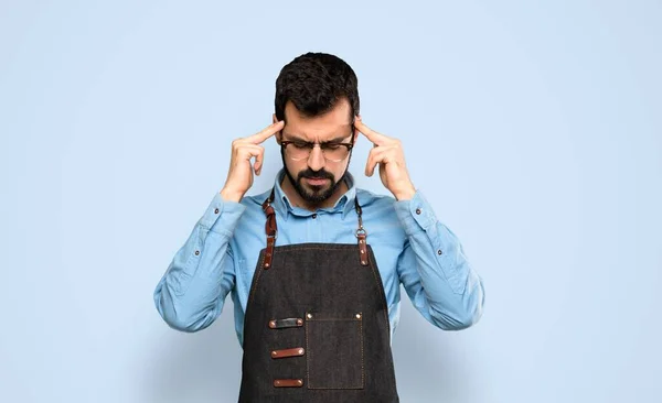 Man Apron Headache Isolated Blue Background — Stock Photo, Image