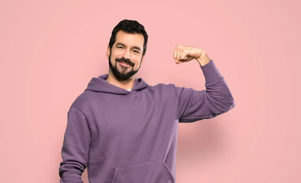 Handsome Man Sweatshirt Doing Strong Gesture Isolated Pink Background — Stock Photo, Image