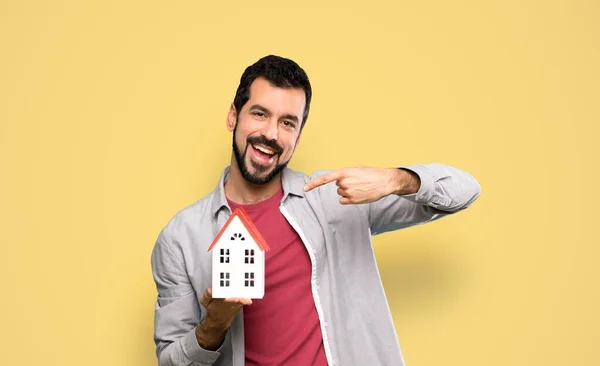 Handsome Man Beard Holding Little House Isolated Yellow Background — Stock Photo, Image