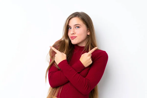 Adolescente Rubia Chica Sobre Aislado Blanco Fondo Apuntando Los Laterales —  Fotos de Stock