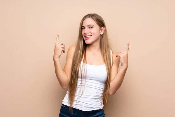 Teenager Blonde Girl Isolated Background Pointing Great Idea — Stock Photo, Image