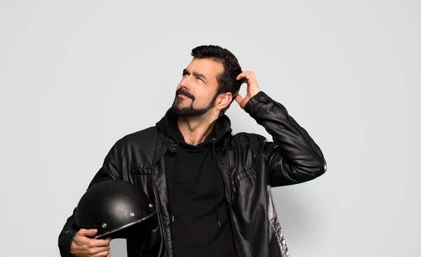 Biker Man Having Doubts While Scratching Head Isolated Grey Background — Stock Photo, Image