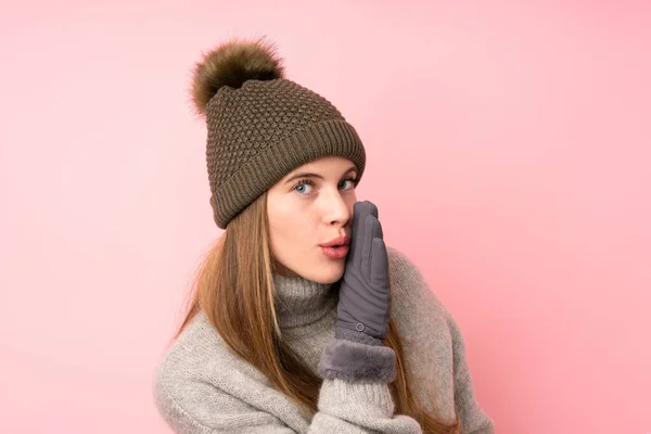 Young Teenager Girl Winter Hat Isolated Pink Background Whispering Something — Stock Photo, Image