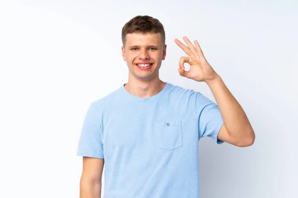 Junger Gutaussehender Mann Über Isoliertem Weißem Hintergrund Zeigt Zeichen Mit — Stockfoto