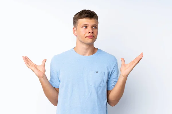 Joven Hombre Guapo Sobre Fondo Blanco Aislado Haciendo Gesto Dudas — Foto de Stock