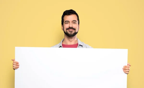 Handsome Man Beard Holding Empty Placard Isolated Yellow Background — 图库照片