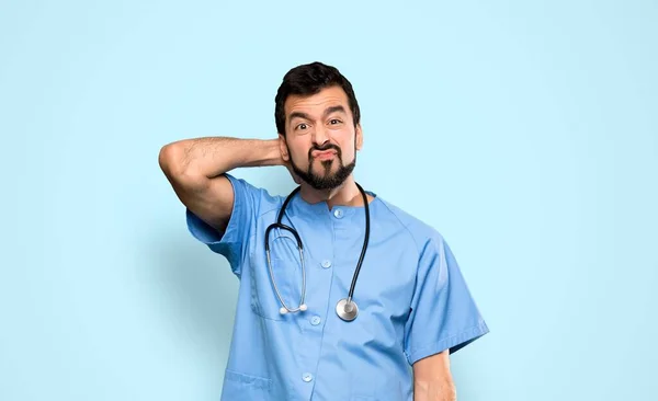 Surgeon Doctor Man Having Doubts Isolated Blue Background — Stock Photo, Image