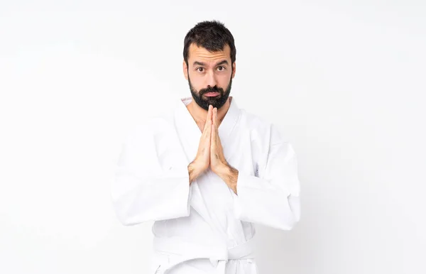 Junger Mann Der Karate Vor Isoliertem Weißen Hintergrund Macht Hält — Stockfoto
