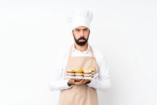 Jongeman Met Muffin Cake Geïsoleerde Witte Achtergrond Met Droevige Depressieve — Stockfoto