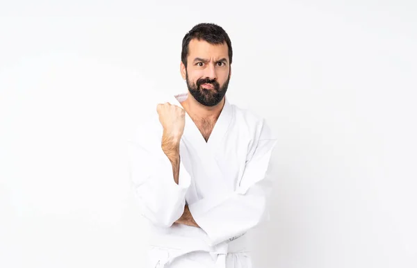 Ung Man Gör Karate Över Isolerad Vit Bakgrund Med Arg — Stockfoto