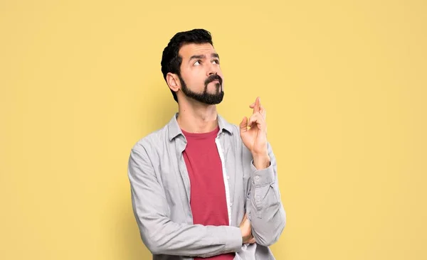 Handsome Man Beard Fingers Crossing Wishing Best Isolated Yellow Background — Stock Photo, Image