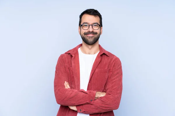 Jonge Blanke Man Draagt Corduroy Jas Blauwe Achtergrond Houdt Armen — Stockfoto