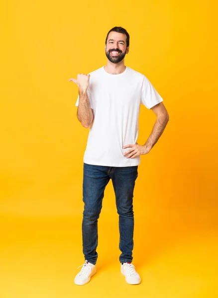 Full Length Shot Man Beard Isolated Yellow Background Pointing Side — Stock Photo, Image