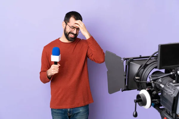 Reporter Man Holding Microphone Reporting News Isolated Purple Background Headache — Stock Photo, Image