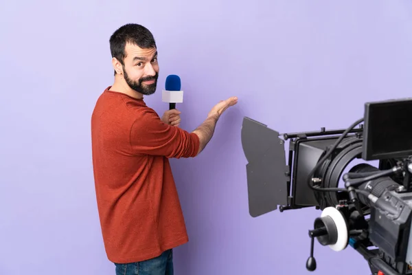 Reporter Man Holding Microphone Reporting News Isolated Purple Background Extending — Stock Photo, Image