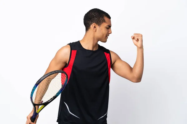 Hombre Afroamericano Sobre Fondo Blanco Aislado Jugando Tenis Celebrando Una —  Fotos de Stock