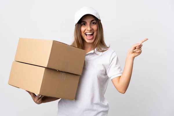 Young Delivery Woman Isolated White Background Surprised Pointing Finger Side — Stock Photo, Image