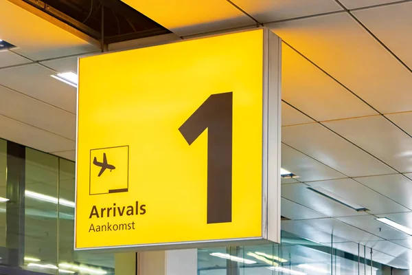 Dutch yellow airport arrival sign — Stock Photo, Image