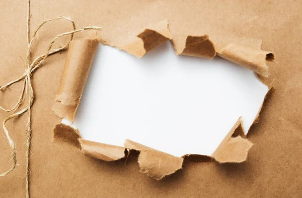 Package ripped on white background — Stock Photo, Image
