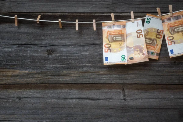 50 Euro banknotes hanging on clothesline — Stock Photo, Image