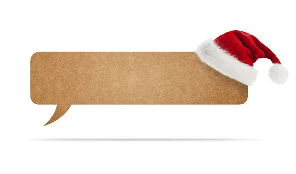 Cardboard speech bubble and Santa Claus hat — Stock Photo, Image