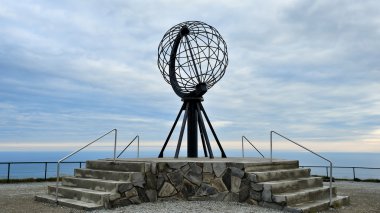 NORDKAPP, NORWAY -  Globe monument at Nordkapp, the northernmost clipart