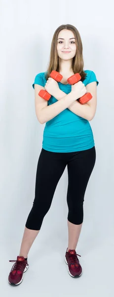 Girl with dumpbells on white background sport concept gym — Stock Photo, Image