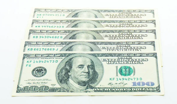 En dollar sedlar på vit bakgrund — Stockfoto