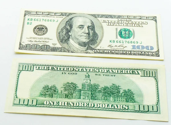 En dollar sedlar på vit bakgrund — Stockfoto