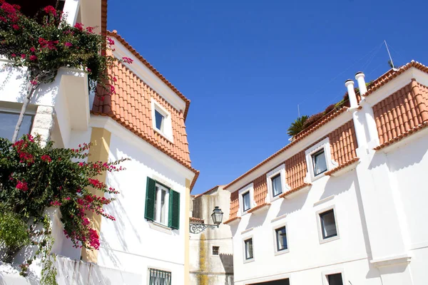 Beautiful view of white houses on the sunny day. Traditional architecture. Cascais. Portugal.