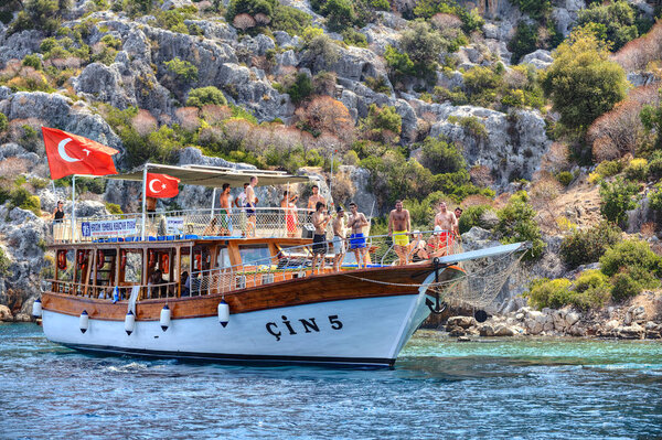 Yacht vacation on Mediterranean, many tourists stand on deck boat