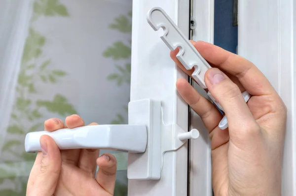 Installation of opening limiter on the pvc window, close-up. — Stock Image Installation of opening limiter on the pvc window, close-up. Stock Image