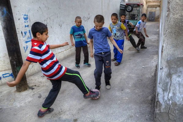 Iranian children playing football in a courtyard, Shiraz, Iran. — Stock Photo, Image