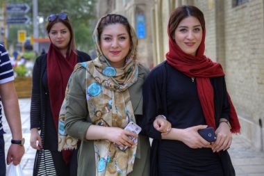 Modern young Iranian women wearing hijabs, Shiraz, Iran. clipart