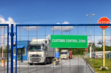 Lorries pass through checkpoint of logistics complex with customs services. clipart