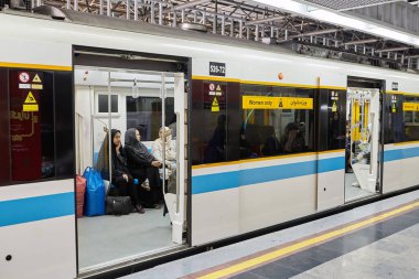 Train carriage in metro with inscription, women only, Tehran, Iran.