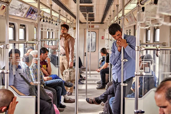 Iranian men go by underground, Tehran, Iran. — Stock Photo, Image